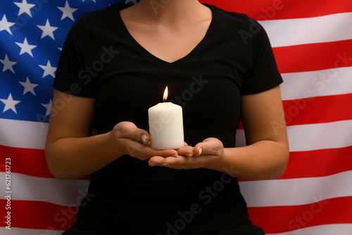 Woman holding burning candl...