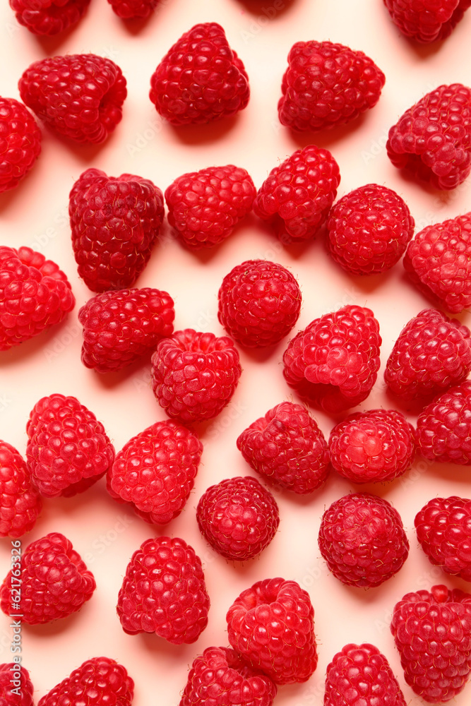 Many fresh raspberries on pink background Many fresh raspberries on pink background