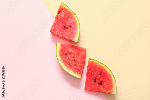 Pieces of fresh watermelon on colorful background