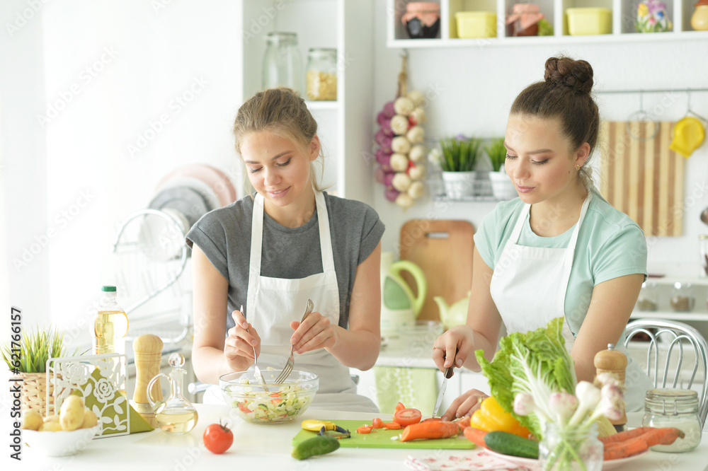 Beautiful teenagers cooking