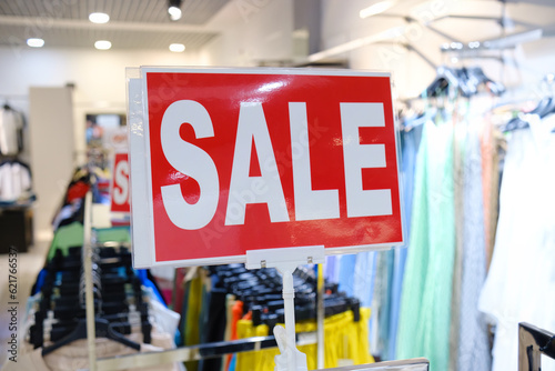 Sale sign, close-up, clothing store.