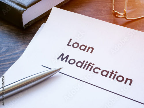 Papers about Loan modification on the table.