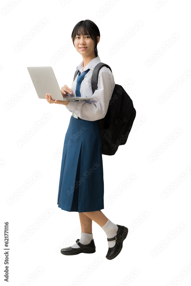 Full body happy smiling Asian student girl wearing uniform standing holding laptop computer backpack, isolated background Full body happy smiling Asian student girl wearing uniform standing holding laptop computer backpack, isolated background