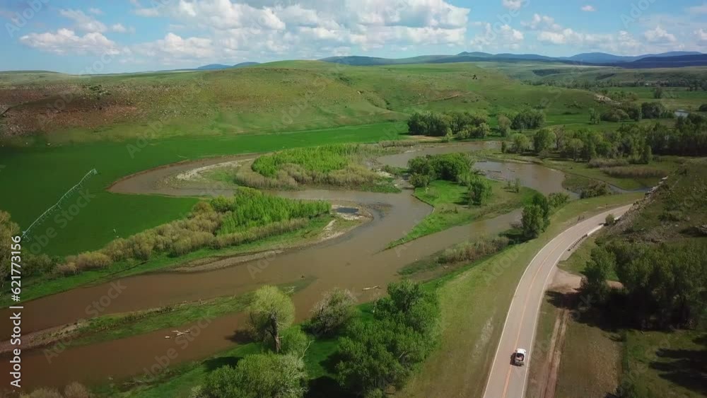 Aerial Shot Of Pickup Truck Moving On Country Road, Drone Moving Backward Over Field - Billings, Montana