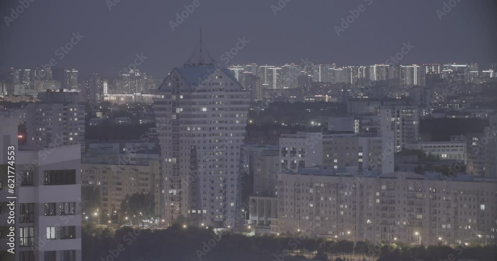 Modern Multi-storey Residential House. Elevated View Cityscape Skyline. Night Light Lighting Timelapse. Backdrop Night Time Lapse. Urban Cityscape At Evening Time. Ungraded, Canon, C-log, C Log, Log.