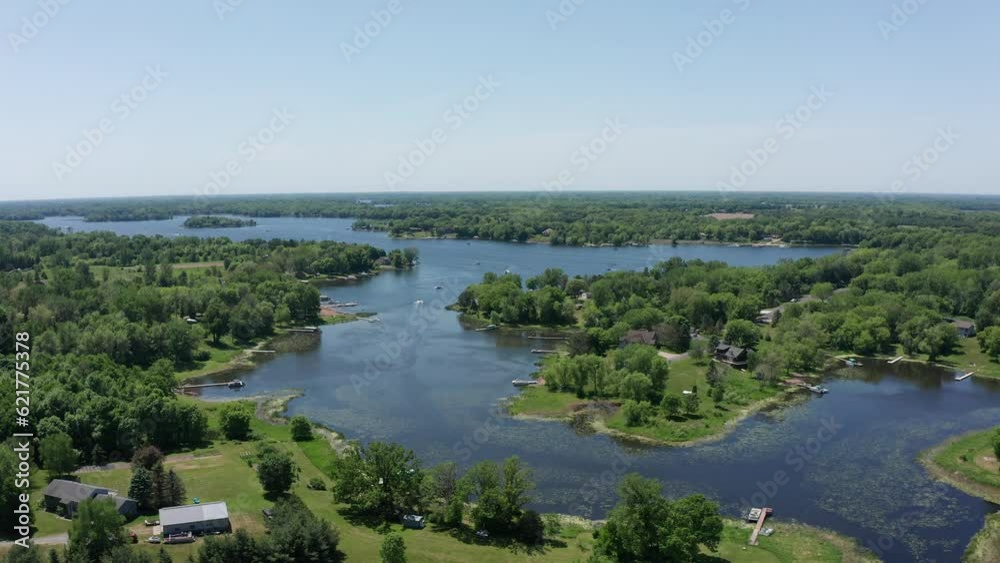Wide reverse pullback shot of North Center Lake in Minnesota. 4k