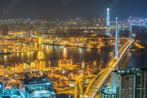 Aerial Night view of the city in Hong Kong with stonecutter bridge