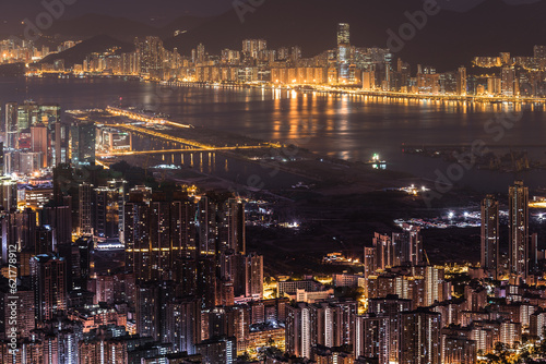 Aerial City Night view of Hong Kong City with victoria harbor and building and street