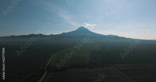 Mount Matutum stratovolcano overlooks the city of General Santos in southern Mindanao, Philippines. Travel concept. photo