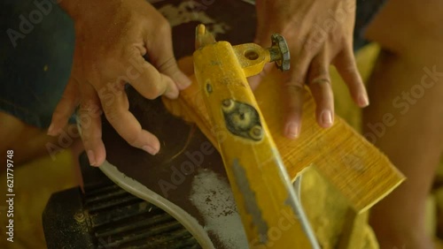 Professional artisans are making traditional Javanese wooden dolls called wayang. The initial process of making this traditional puppet was made from whole wood which was cut and smoothed photo