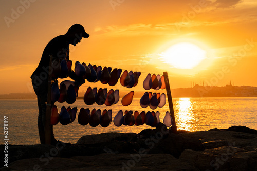 balloon seller at cloudy sunset photo