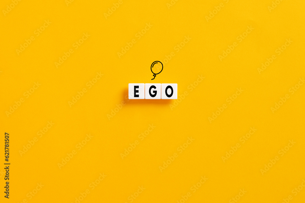 White letter blocks on yellow background with the word ego. Selfishness or inflated ego in psychology concept. White letter blocks on yellow background with the word ego. Selfishness or inflated ego in psychology concept.