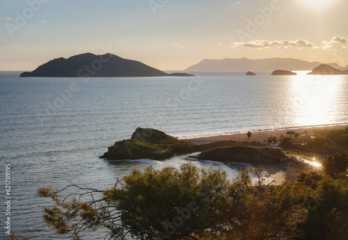 over the sea coast, travel in Turkey, Fethiye city. adventure vacation, healthy lifestyle, sunset time over Calish beach