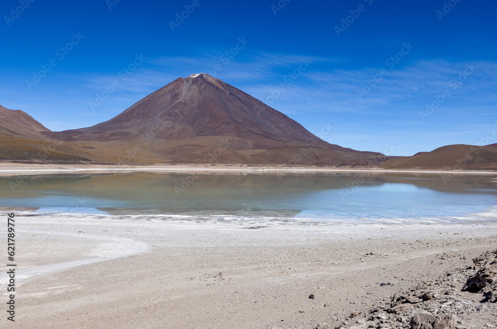 Picturesque Laguna Verde with Licancabur Volcano, just one natural sight while traveling the scenic lagoon route through the Bolivian Altiplano