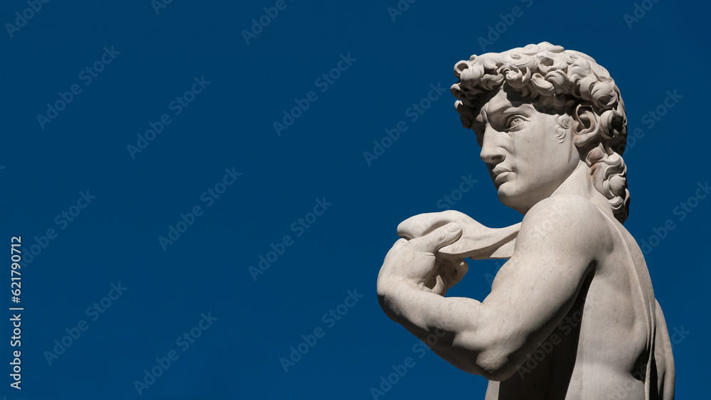 Michelangelo's David, a masterpiece of sculpture symbol of Italian Renaissance. Outdoor replica in Florence (with blue sky and copy space) Michelangelo's David, a masterpiece of sculpture symbol of Italian Renaissance. Outdoor replica in Florence (with blue sky and copy space)