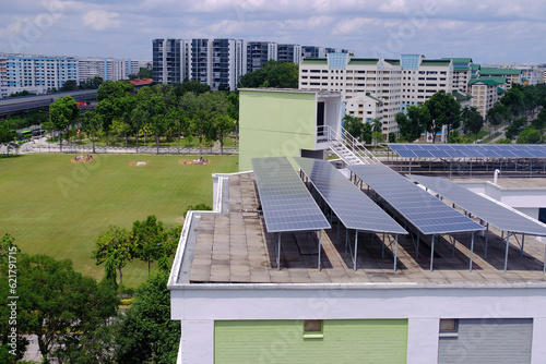 Photography Common to see solar panels installed on roof tops of HDB blocks in Singapore to