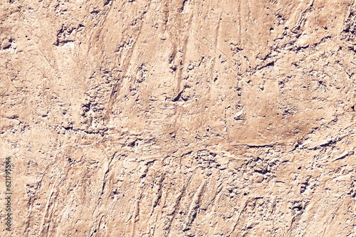 Yellow stone texture close-up. Rough yellow stone wall. Natural rock texture