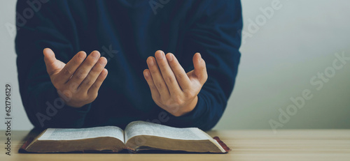 Photography Man hand prayer god faith holy worship on hope religion with an open bible