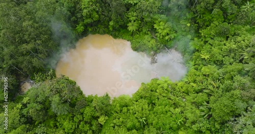 Top view of Lake Agco Mud Spa, natural lake of boiling sulfuric mud and waters heated by the underground volcanic vents. Mount Apo in Mindanao, Philippines. photo