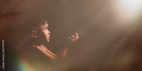 Stampa su tela Portrait of praying boy on dark background