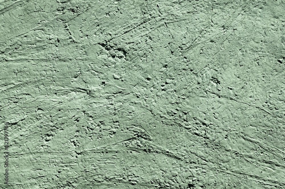 Obraz premium Green stone texture close-up. Rough green stone wall. Natural rock texture