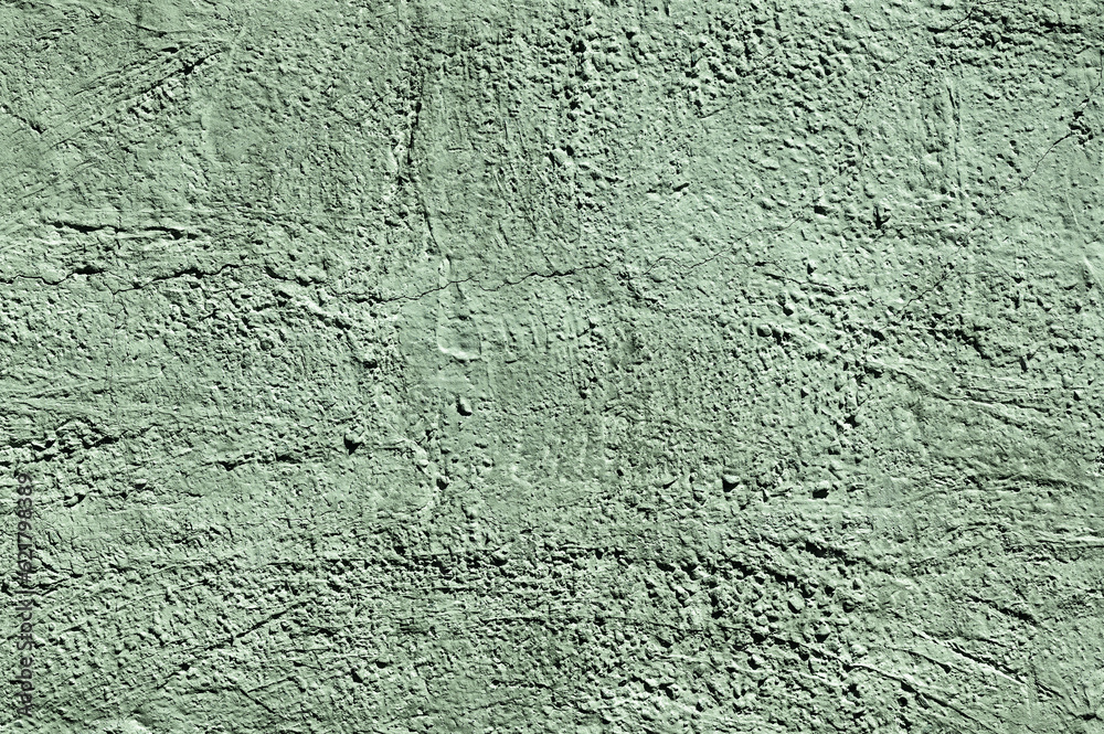 Green stone texture close-up. Rough green stone wall. Natural rock texture Green stone texture close-up. Rough green stone wall. Natural rock texture