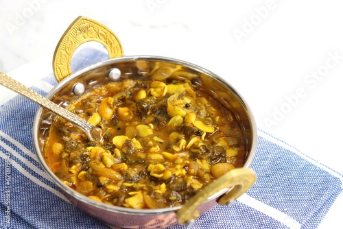 Alucha fatfate or alu wal chi patal bhaji is a traditional, authentic Maharashtrian dish. colocasia leaves and lima beans curry. It has a sweet and sour taste. Valachi bhaji. Fadfade. Monsoon recipes. photo