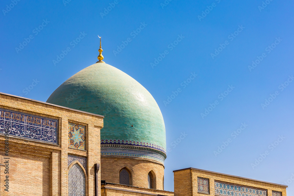 Close-up. The blue dome of a Muslim mosque against the blue sky. Eastern religion.