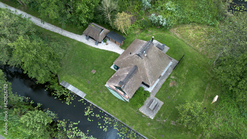 House at National Park de Weerribben near Kalenberg. Steenwijkerland. Netherlands. Peatfields. Canals. Aerial. photo