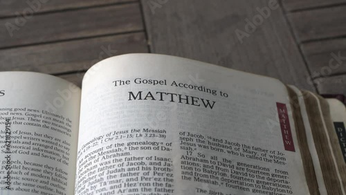 Close up and panning view on the book of Matthew of the bible.