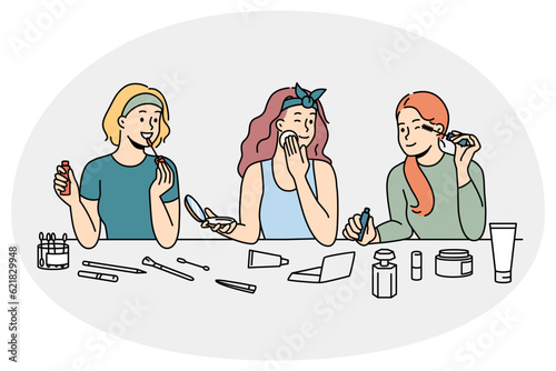 Happy girls have fun applying makeup enjoying beauty day together at home. Smiling girlfriends do cosmetic procedures on spa weekend indoors. Vector illustration.