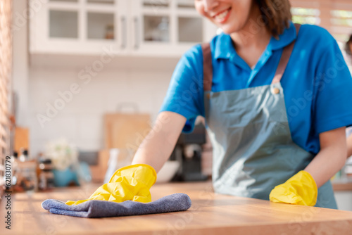 Fotografi Housework or house keeping service female cleaning dust in home, cleaning agency small business