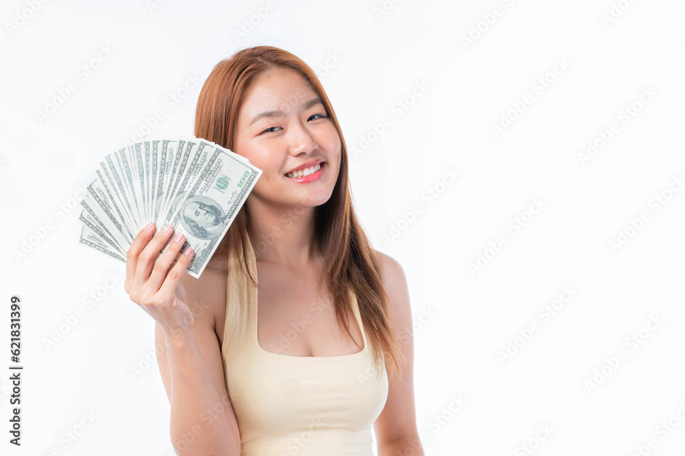 Successful beautiful Asian business young woman holding money US dollar bills in hand on white background , business concept Successful beautiful Asian business young woman holding money US dollar bills in hand on white background , business concept