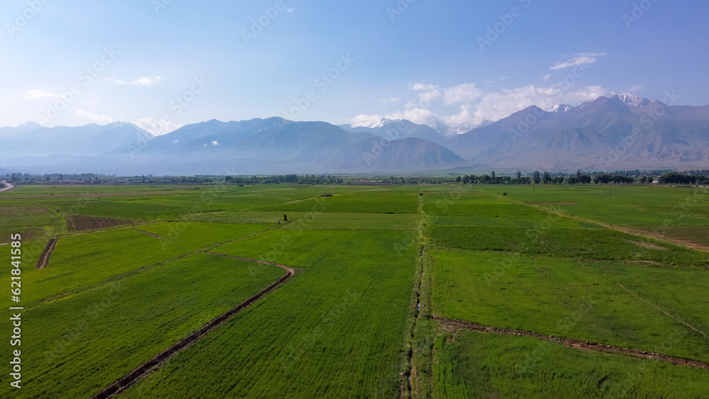 View of the mountains and the clearing in Kyrgyzstan, Kochkor, view from the top, aerial