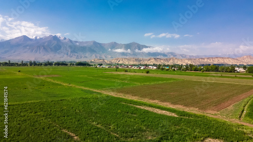 View of the mountains and the clearing in Kyrgyzstan, Kochkor, view from the top, aerial