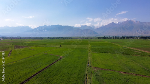 View of the mountains and the clearing in Kyrgyzstan, Kochkor, view from the top, aerial © Darya