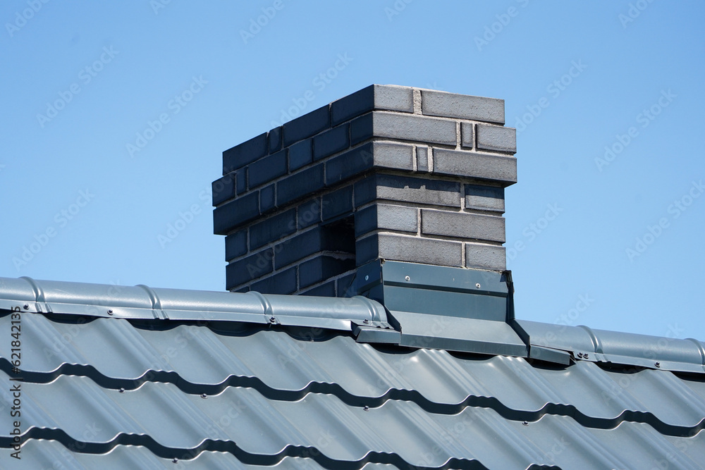 Chimney. Roof of a building with chimney. Chimney. Roof of a building with chimney.