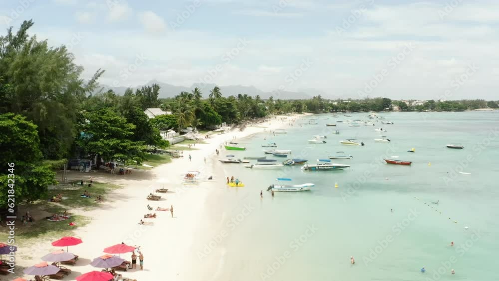 Aerial view of a beautiful beach with yachts in the background. on the island of Mauritius. Aerial view of a beautiful beach with yachts in the background. on the island of Mauritius.