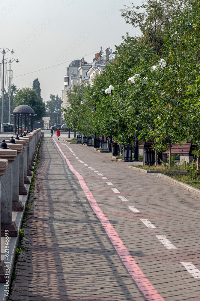 A fragment of the city embankment on a summer day