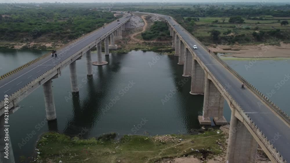 Highway bridge built over the river basin in the Indian rural terrain, Aerial view Highway bridge built over the river basin in the Indian rural terrain, Aerial view