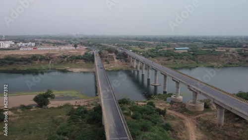 Wallpaper Mural Highway bridge built over the river basin in the rural terrain, India, Aerial view, Slow motion Torontodigital.ca