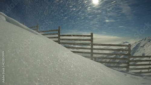 Wind Transport over snowdrifts, lighting shines with sun rays. On Throwing snow drifts on January day. Wind Transport straying into snowdrifts by the fence, frost and sun, wonderful day. blowing wind.