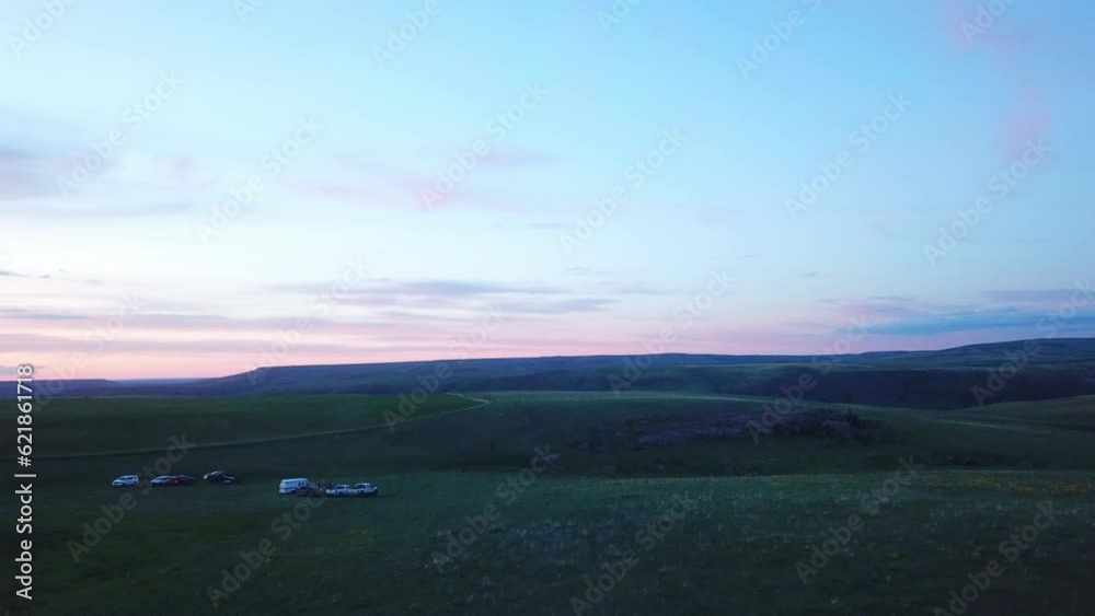 Aerial Shot Of Vehicles On Mountain Against Sky At Sunset, Drone Flying Over Meadow - Billings, Montana Aerial Shot Of Vehicles On Mountain Against Sky At Sunset, Drone Flying Over Meadow - Billings, Montana