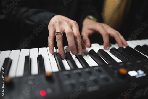 close-up of a pianist's hands while playing the piano