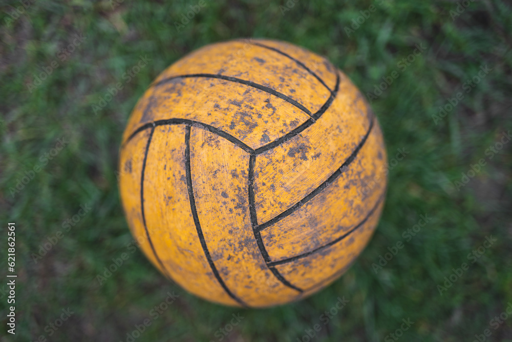 close up of a volleyball ball on the grass close up of a volleyball ball on the grass