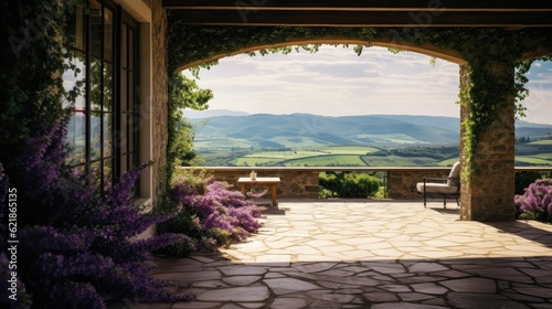 a tiled veranda with lavender shrubs overlooking Tuscany rolling hills with vinyards and country homes