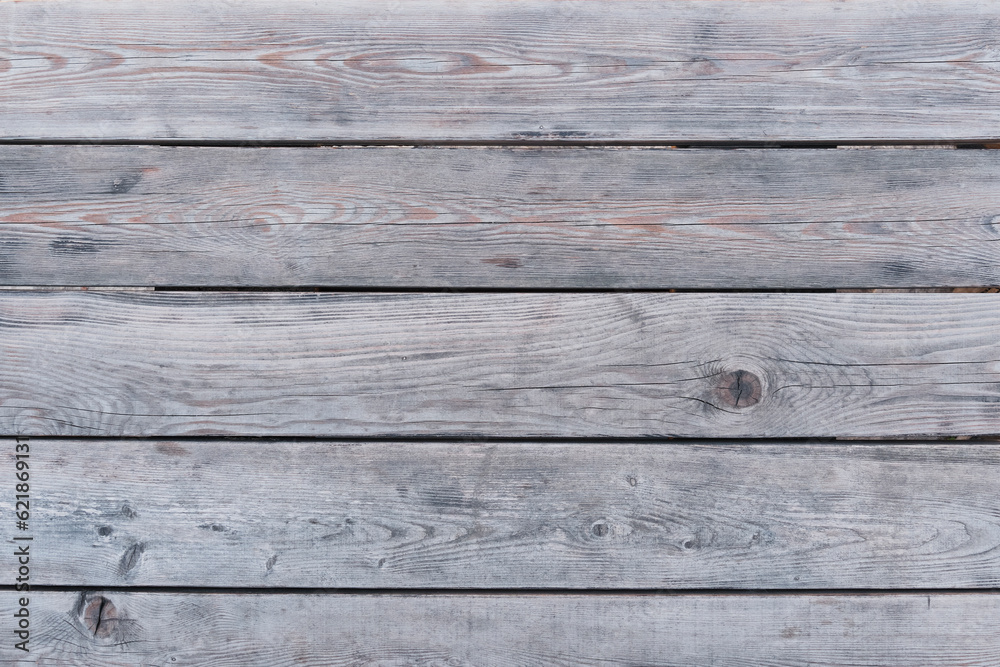 Old gray-brown wood background made of natural wood in grunge style. Top view.