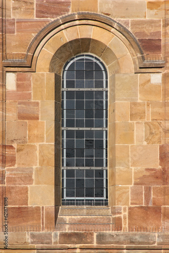 Romanesque round arch window at the Augustine monastery church in the old village of Pfaffen-Schwabenheim in Germany