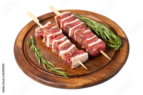 Beef skewer. Shish kebab prepared with raw ribeye and minced meat isolated on white background