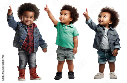 Set of fashionable portraits of a happy, cute Afro-American child toddler in different poses - pointing his finger up, showing something
